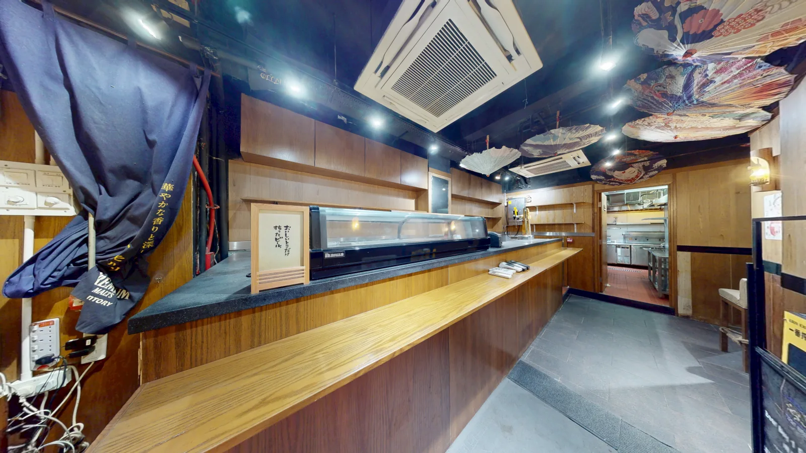 Shop at The WOL, Central — main dining bar with sushi case